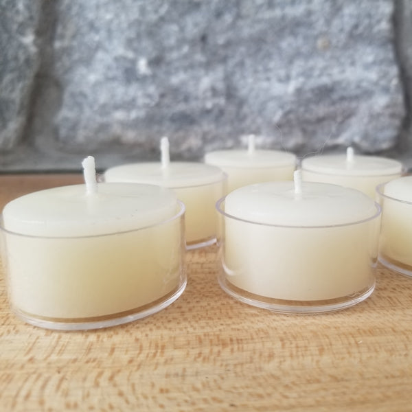 White beeswax tealights in clear cups