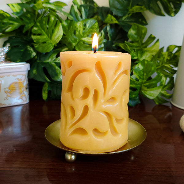 Beeswax candle with carved design